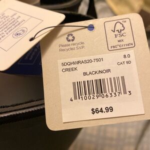 Rubber boots never been worn. Tags are still attached to them.